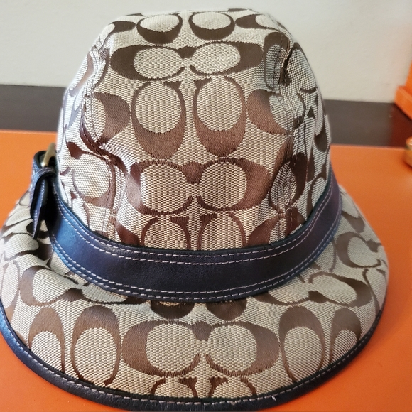 Coach Accessories - COACH bucket hat Tan Jacquard CC's with Navy Blue Leather band and buckle